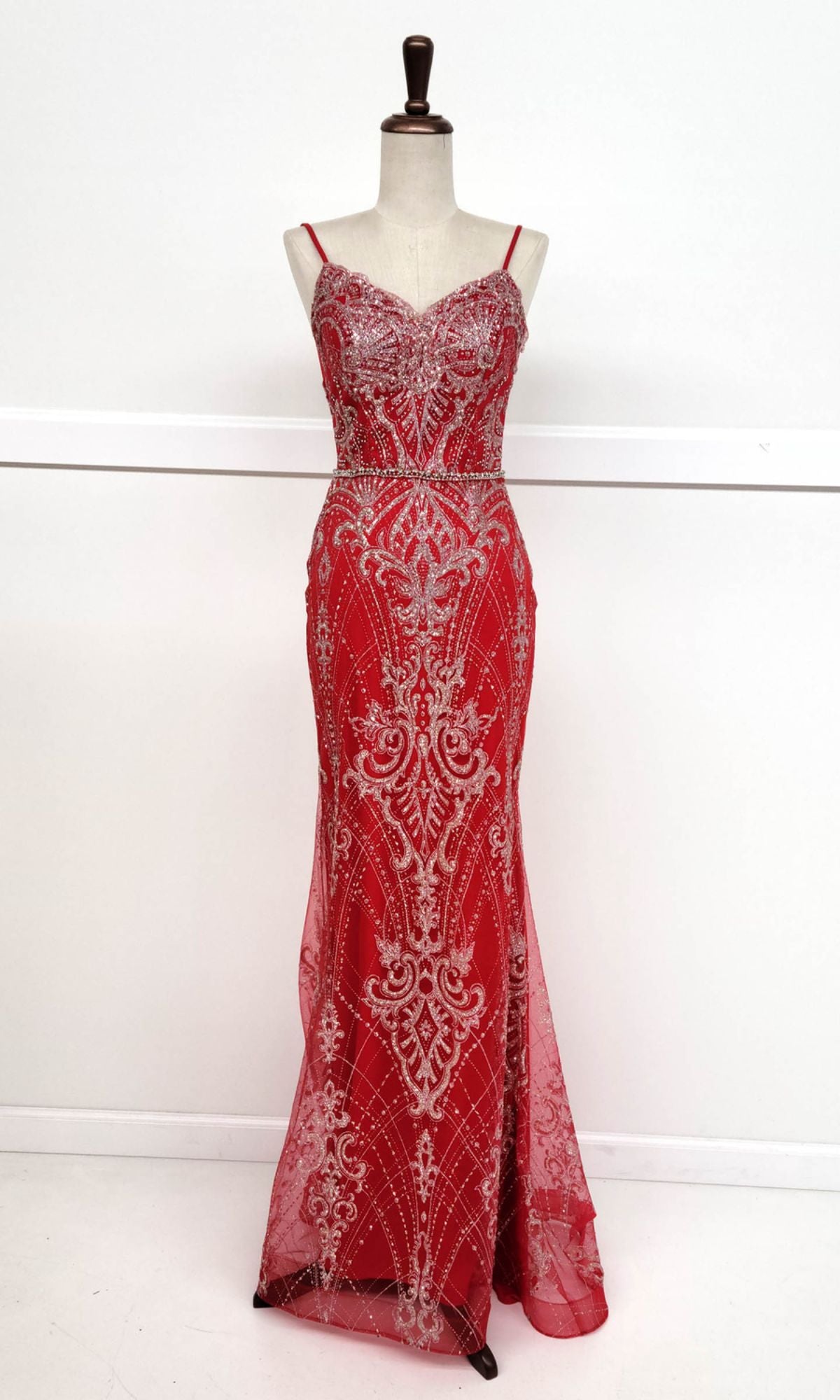 The Lace-Up Long Glitter Prom Dress (Chicas CHF3053) features red sequins with silver detailing, thin straps, and a fitted silhouette, displayed on a dress form against a plain white background.